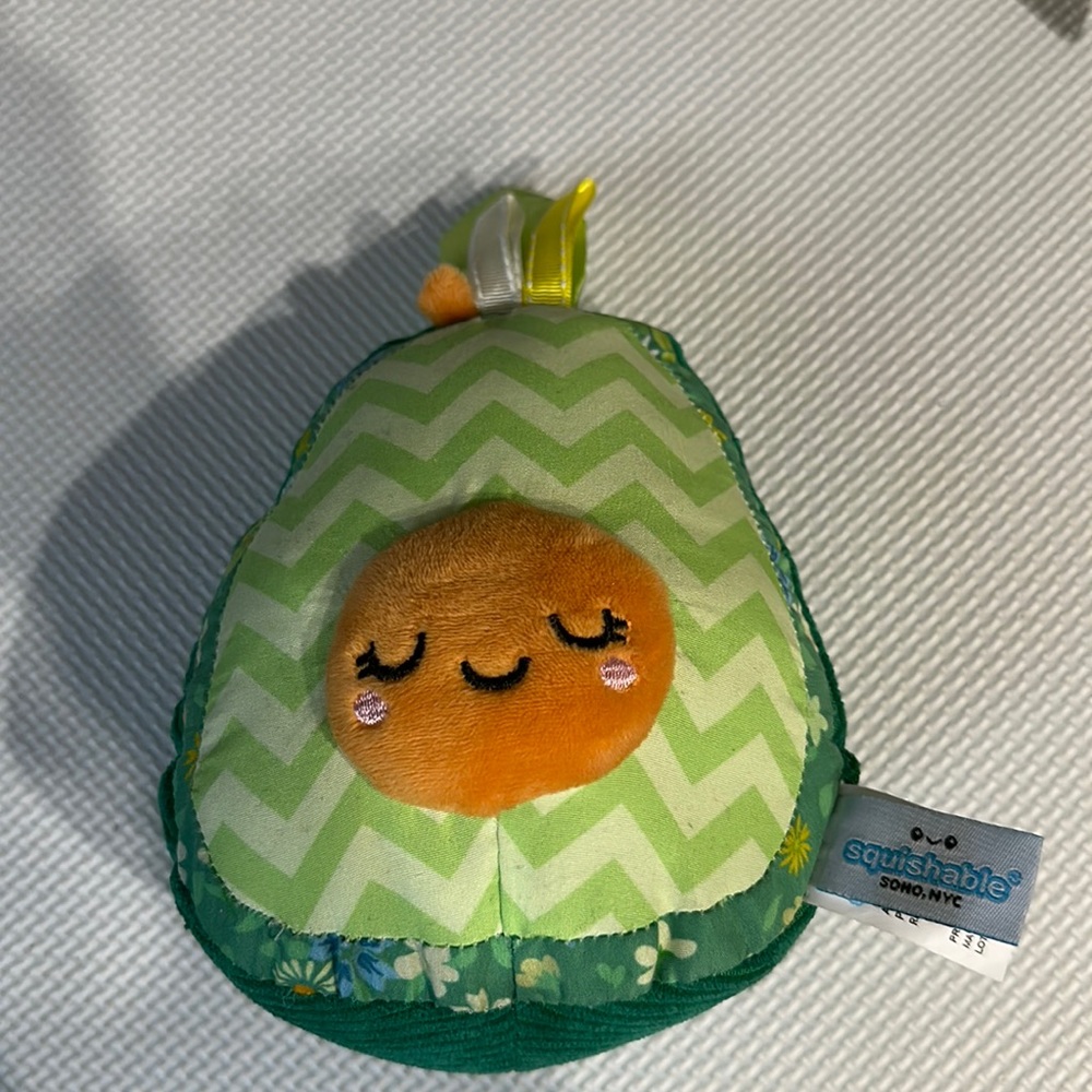 Avocado squishable baby rattle